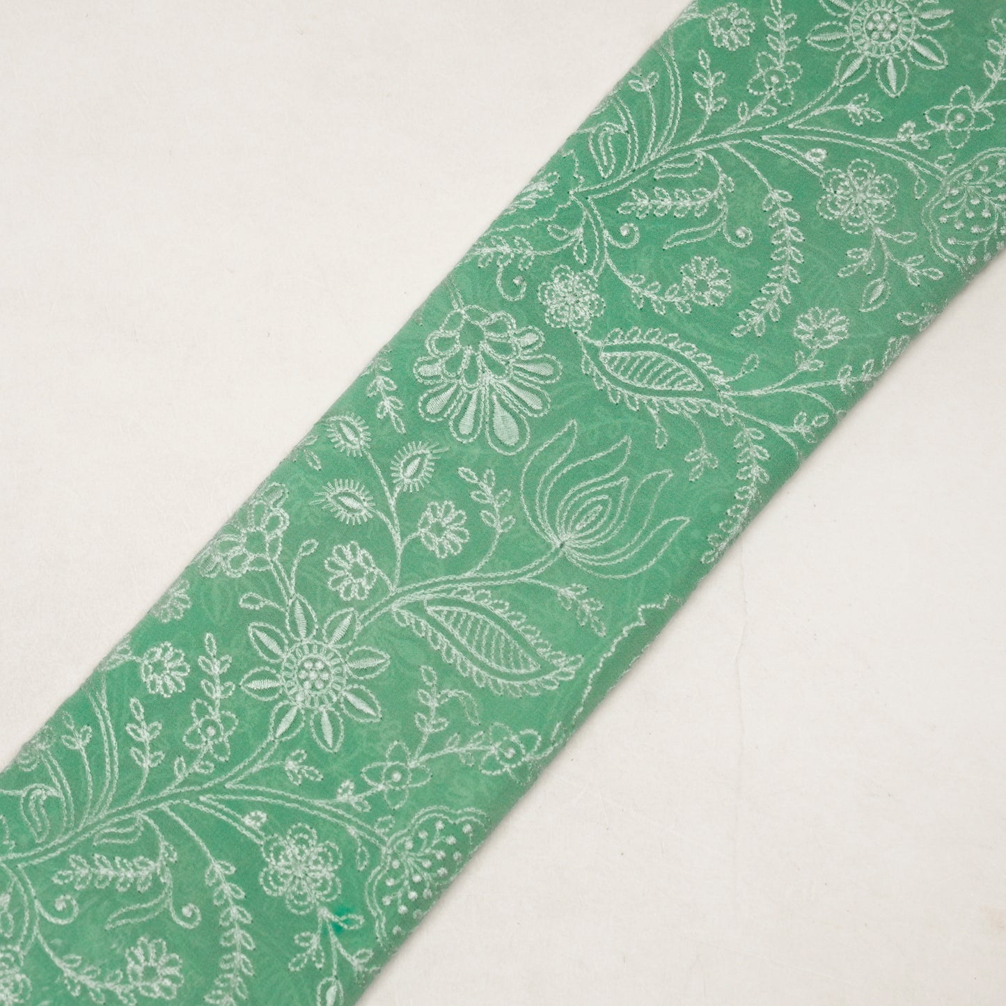 Tiesha Aqua Viscose Raw Silk Embroidered Fabric in Jaal Pattern