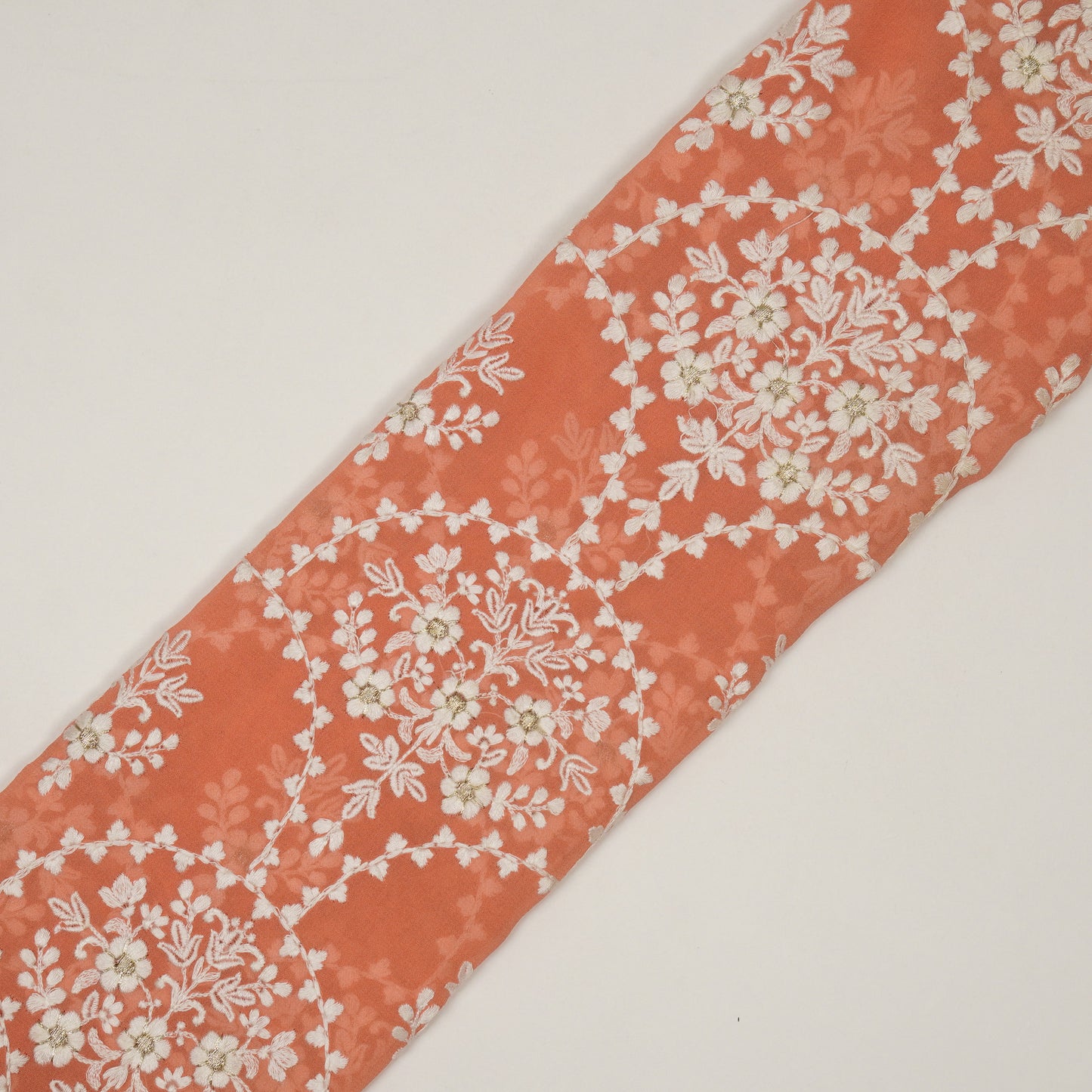 Mritsa Peach Viscose Georgette Embroidered Fabric in Jaal Pattern