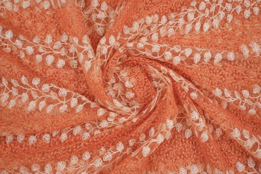 Kaira Peach Nylon Net Embroidered Fabric in Jaal Pattern