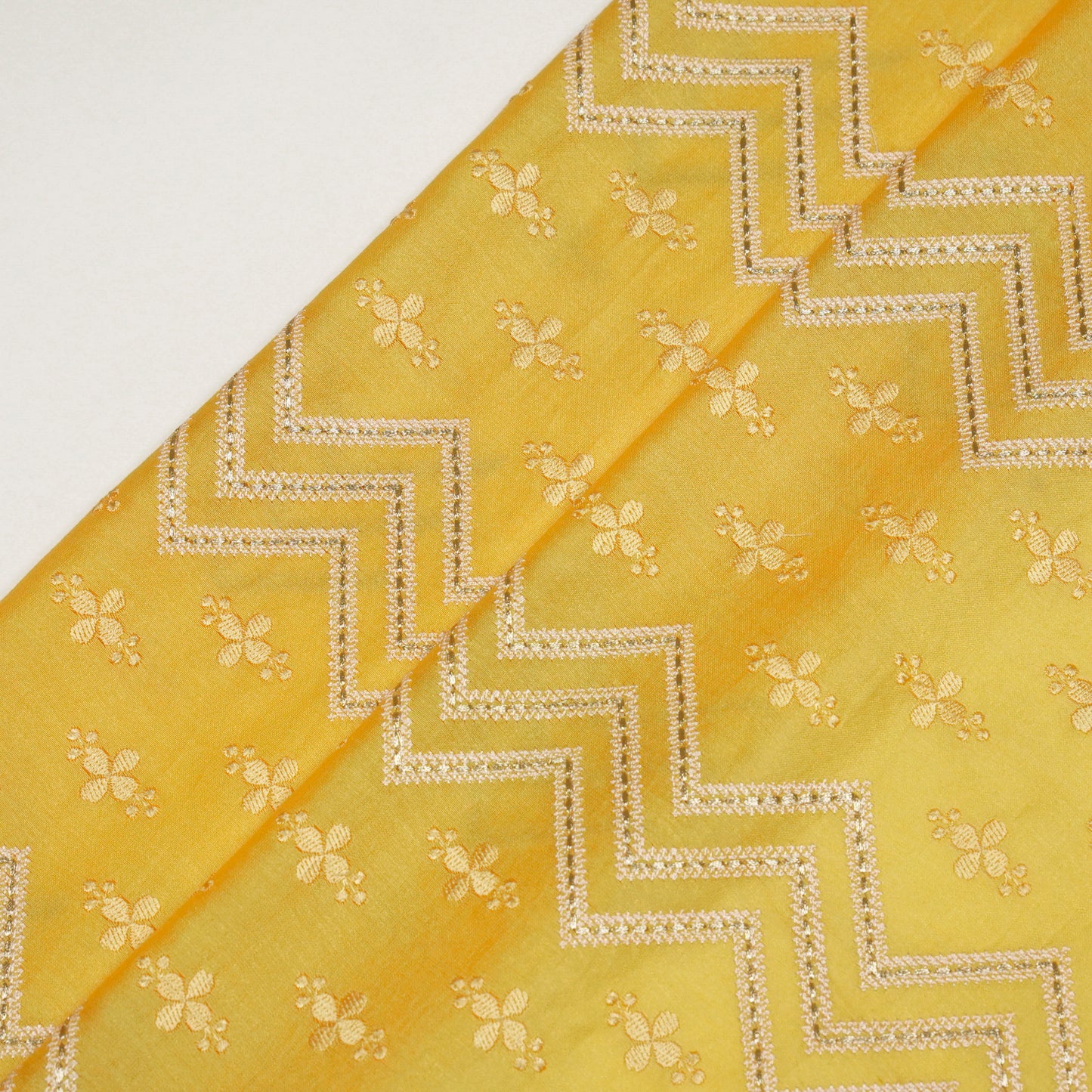 Umi Gold Viscose Raw Silk Embroidered Fabric in Jaal Pattern