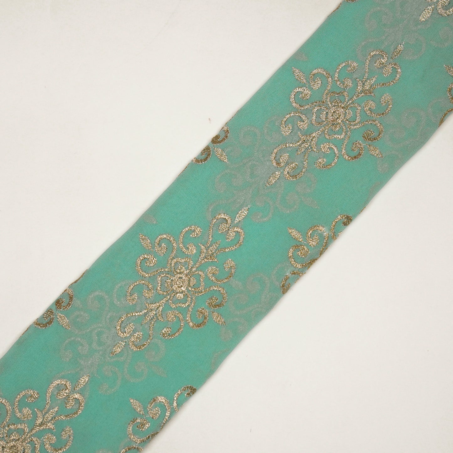 Urwi Turquoise Viscose Georgette Embroidered Fabric in Buta